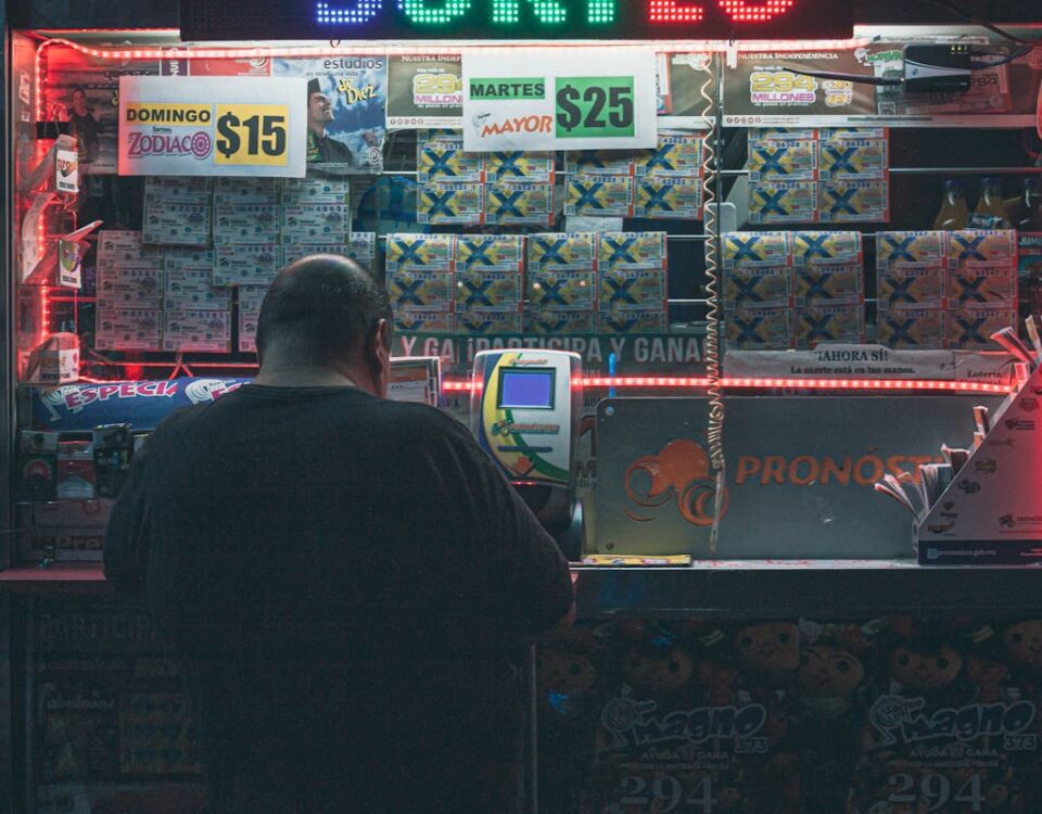Jogo do Bicho: conheça dicas e riscos das apostas Photo of Man Buying a Lottery Voucher